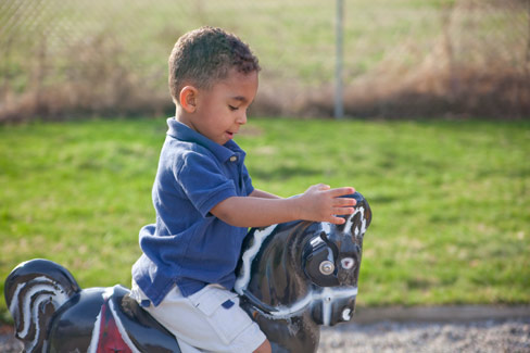 Little Boy Playing in Park